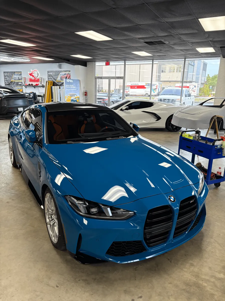 Blue BMW M3 with a glossy finish in the Coast 2 City shop